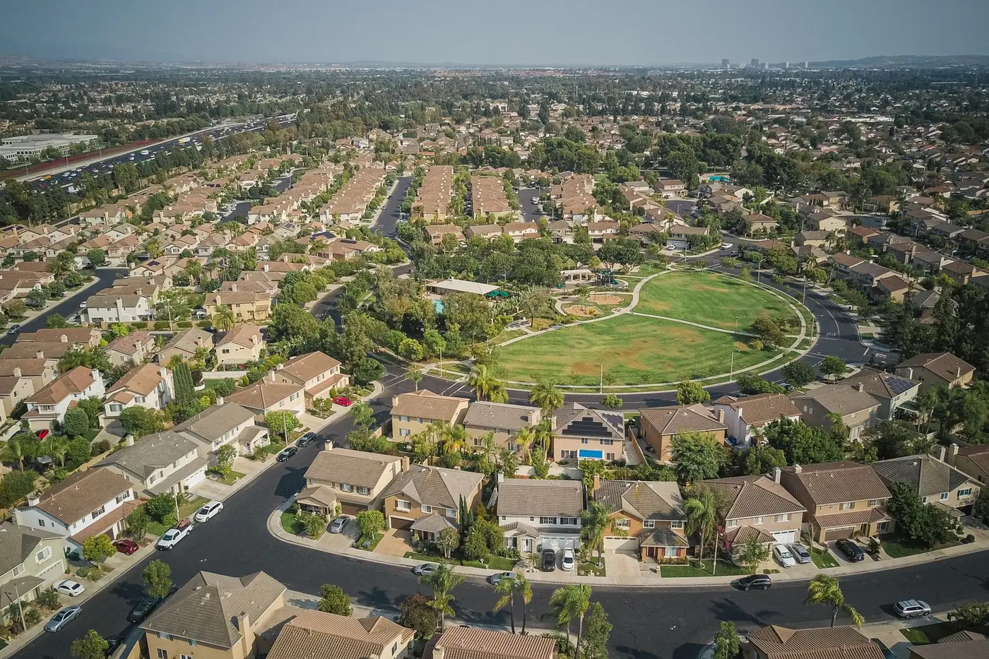 Aerial view of a suburban neighborhood around a park